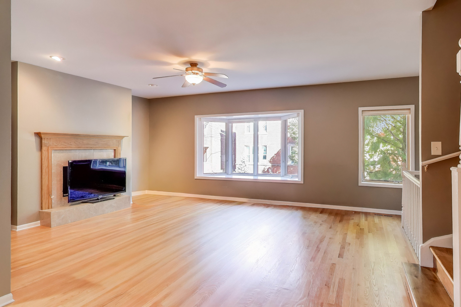 2305 West Thomas Street, Unit 1 Chicago, IL 60622 - Photo 8 of 34 a view of an empty room with a window and wooden floor