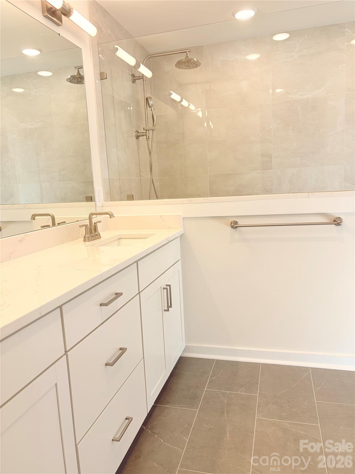 5214 Holw Br Road Charlotte, NC 28278 - Photo 11 of 17 a bathroom with a sink a vanity and a mirror