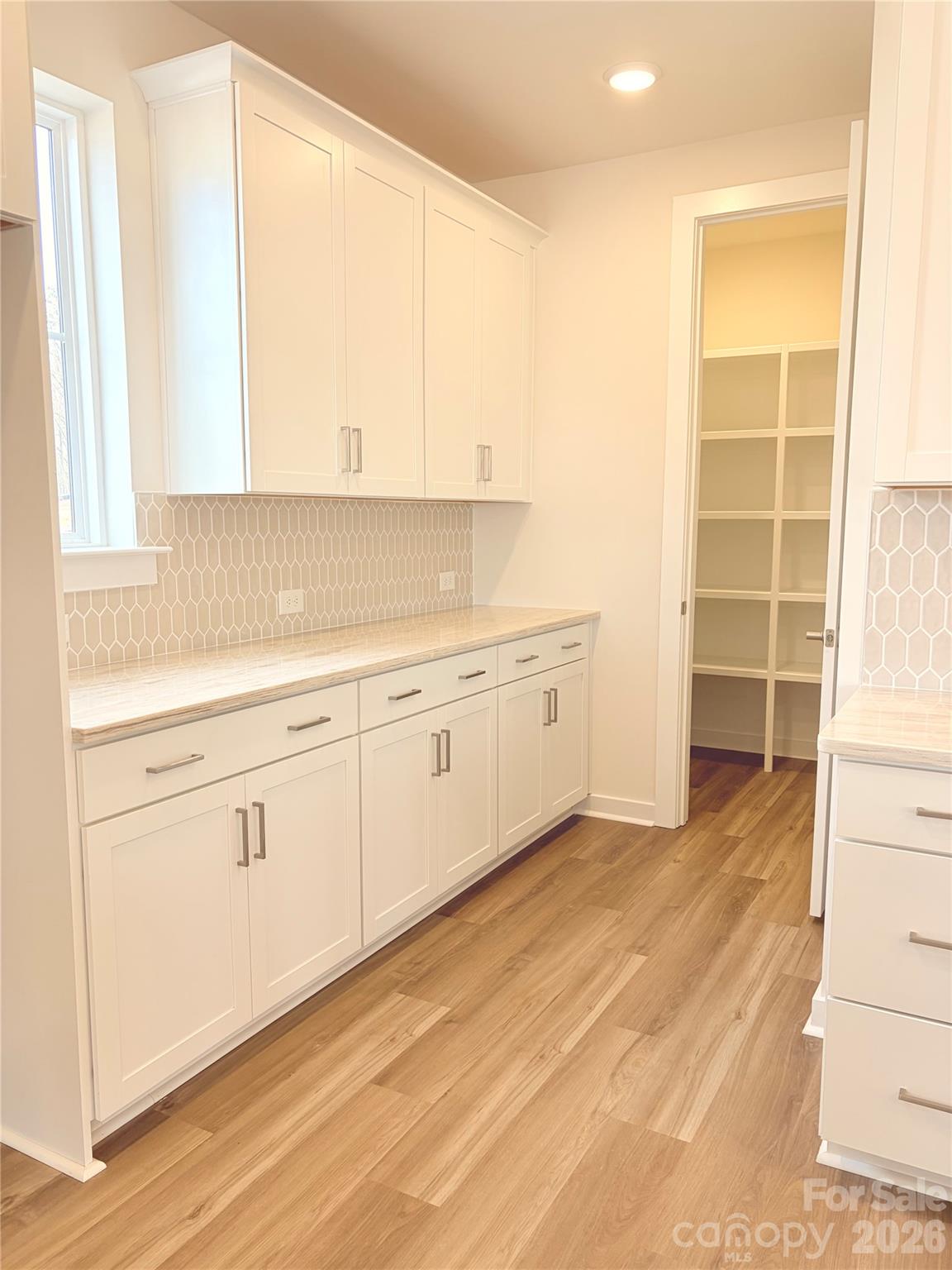 5214 Holw Br Road Charlotte, NC 28278 - Photo 14 of 17 a view of a kitchen with wooden floor and a sink