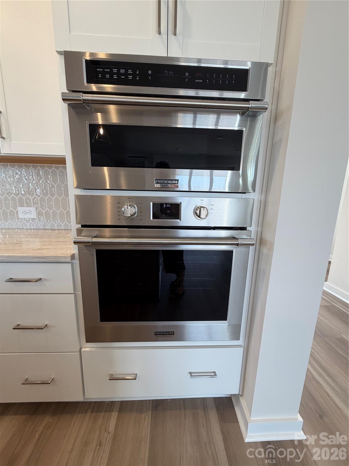 5214 Holw Br Road Charlotte, NC 28278 - Photo 4 of 17 a stove top oven sitting inside of a kitchen