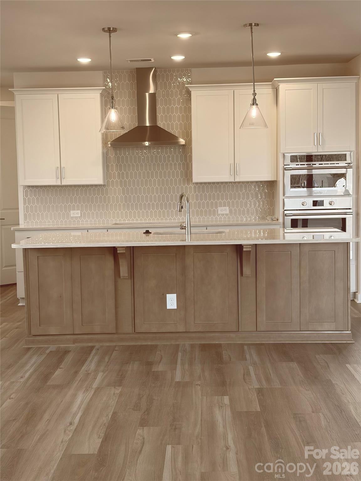 5214 Holw Br Road Charlotte, NC 28278 - Photo 6 of 17 a large kitchen with stainless steel appliances granite countertop a stove a sink and a microwave