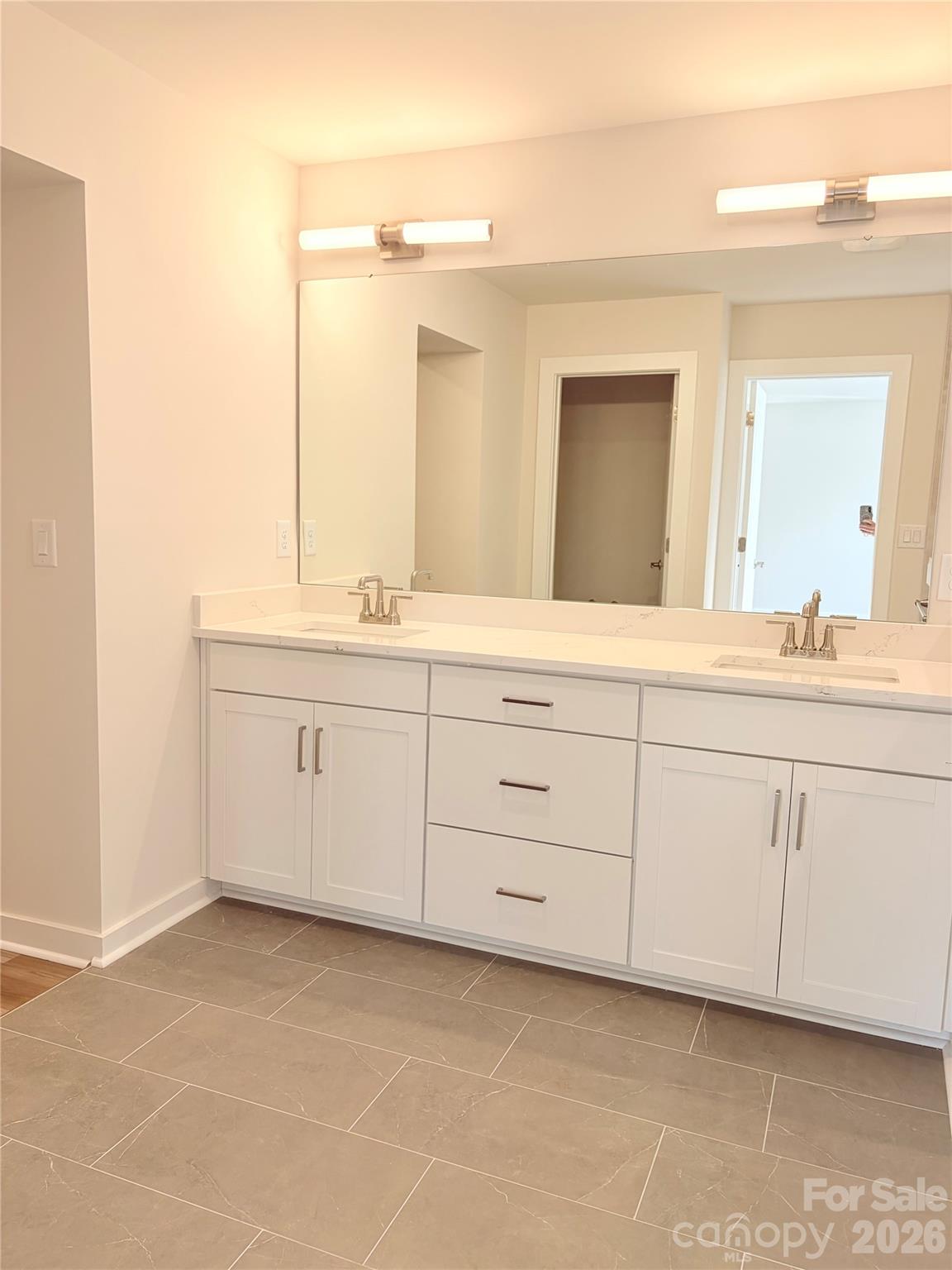 5214 Holw Br Road Charlotte, NC 28278 - Photo 10 of 17 a bathroom with a sink and a mirror