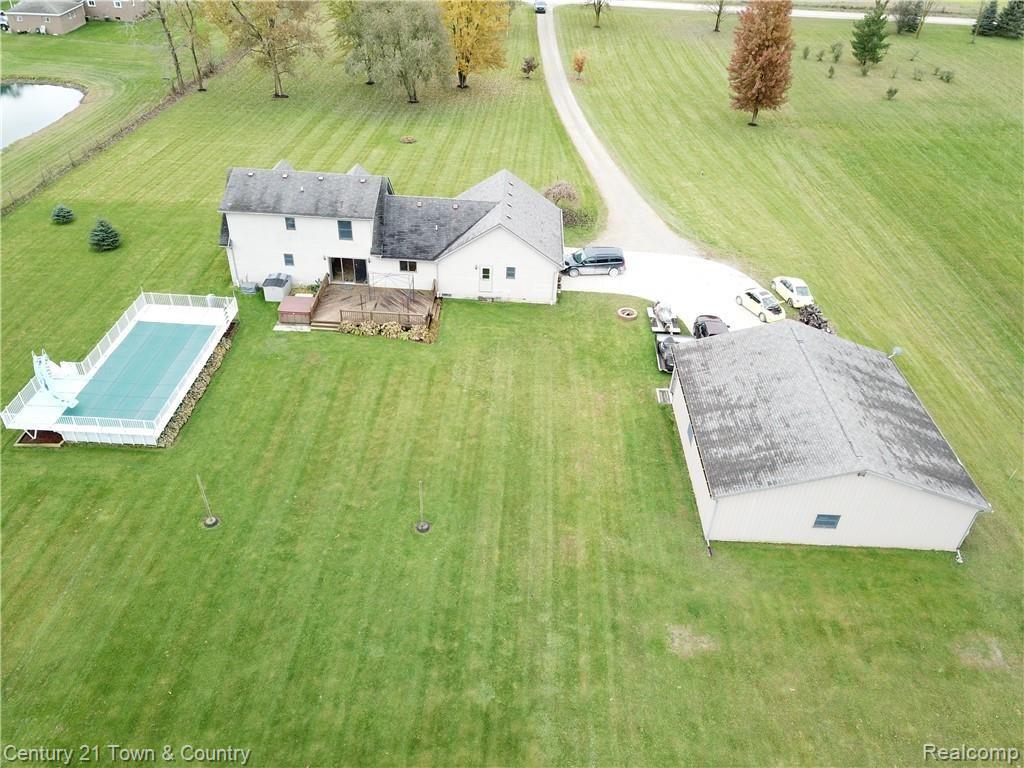 10352 Weber Road Columbus, MI 48063 - Photo 41 of 46 Rear view of home, pole barn and Kayak Pool