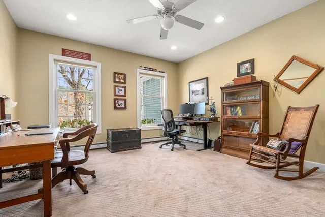 a view of a livingroom with workspace and a couch