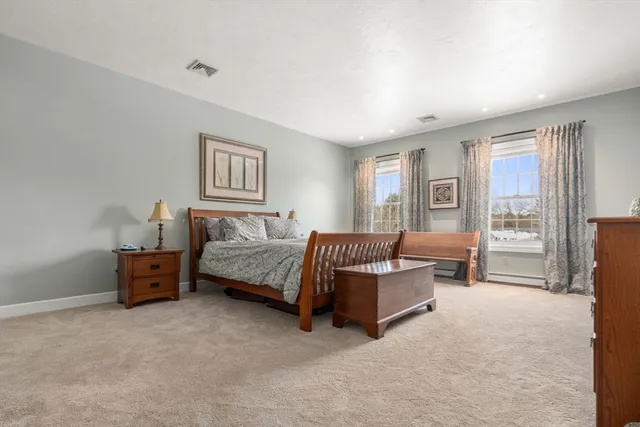 a living room with furniture and a lamp