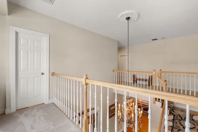 a view of hallway with staircase