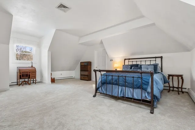a bedroom with furniture and natural light