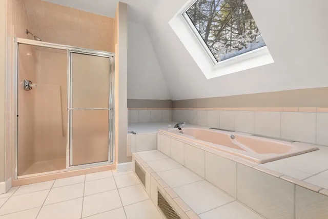 a utility room with a shower and closet