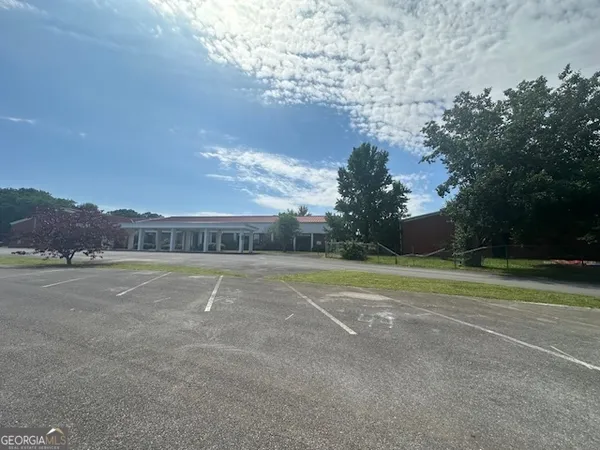 a view of an outdoor space and tennis court