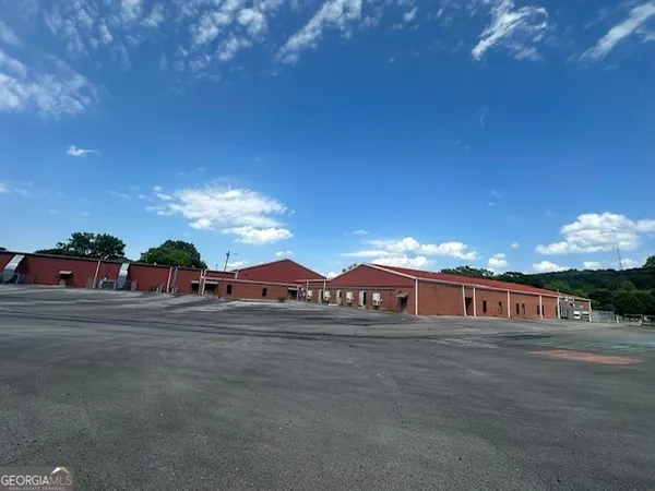 a view of a big house with a big yard