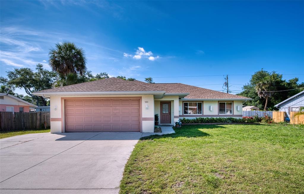541 Falkland Road Venice, FL 34293 - Photo 1 of 22 a front view of a house with a garden and yard