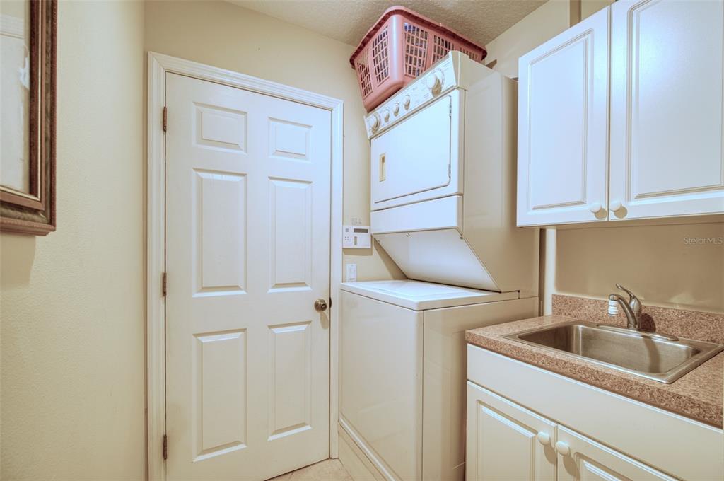 541 Falkland Road Venice, FL 34293 - Photo 13 of 22 a kitchen with a sink and cabinets