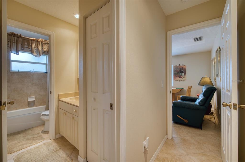 541 Falkland Road Venice, FL 34293 - Photo 16 of 22 a bedroom with a bed and a view of bathroom