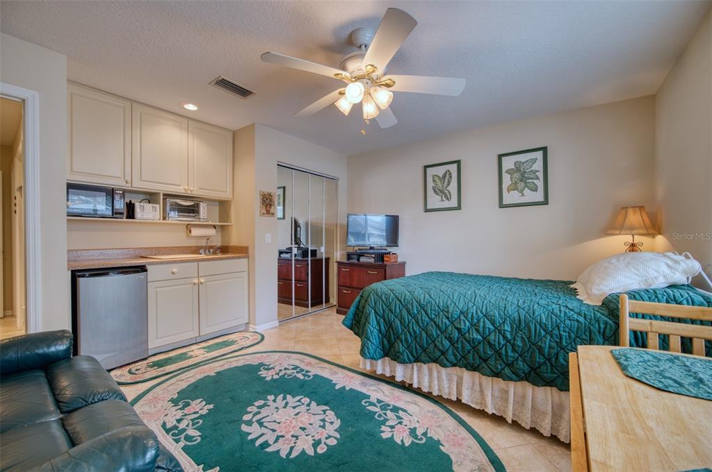 541 Falkland Road Venice, FL 34293 - Photo 17 of 22 a living room with kitchen island granite countertop furniture and a rug