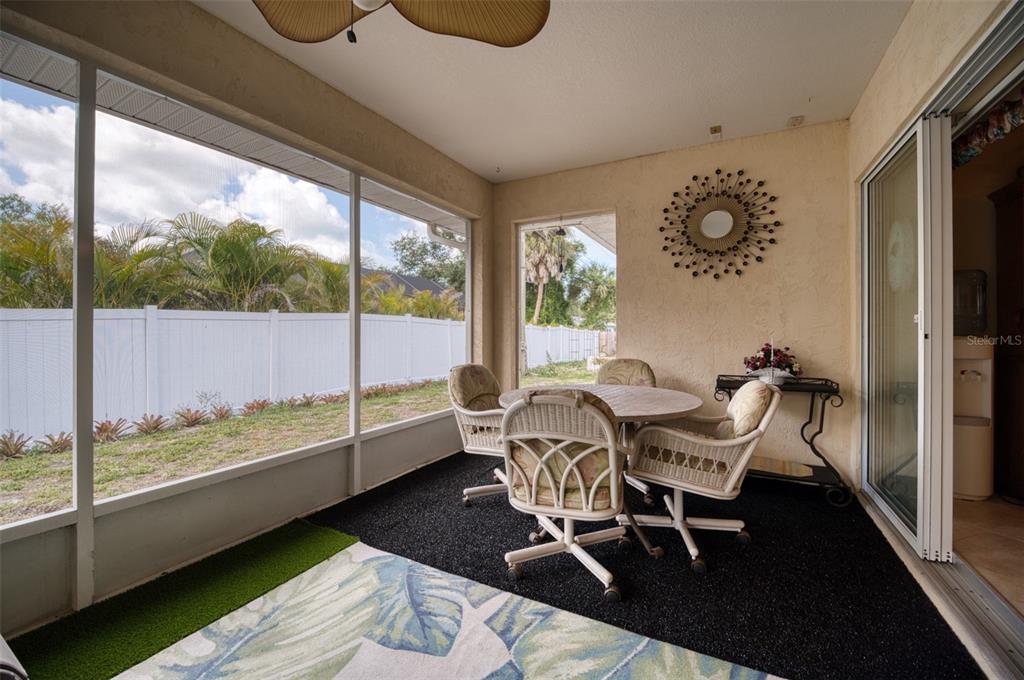 541 Falkland Road Venice, FL 34293 - Photo 18 of 22 a dining room with furniture and wooden floor