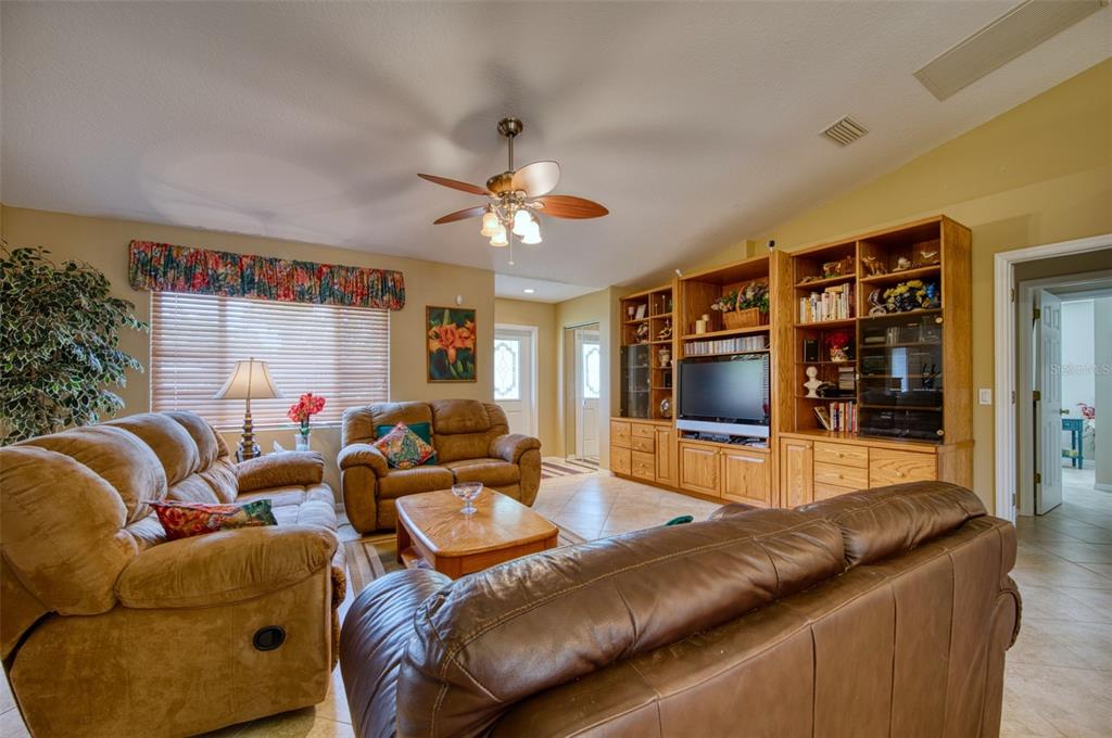 541 Falkland Road Venice, FL 34293 - Photo 4 of 22 a living room with furniture and a flat screen tv