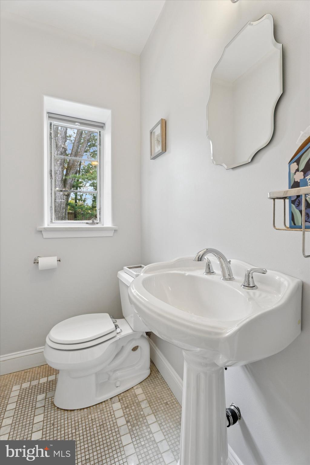 110 Raynham Road Merion Station, PA 19066 - Photo 23 of 59 a bathroom with a sink a toilet and a mirror