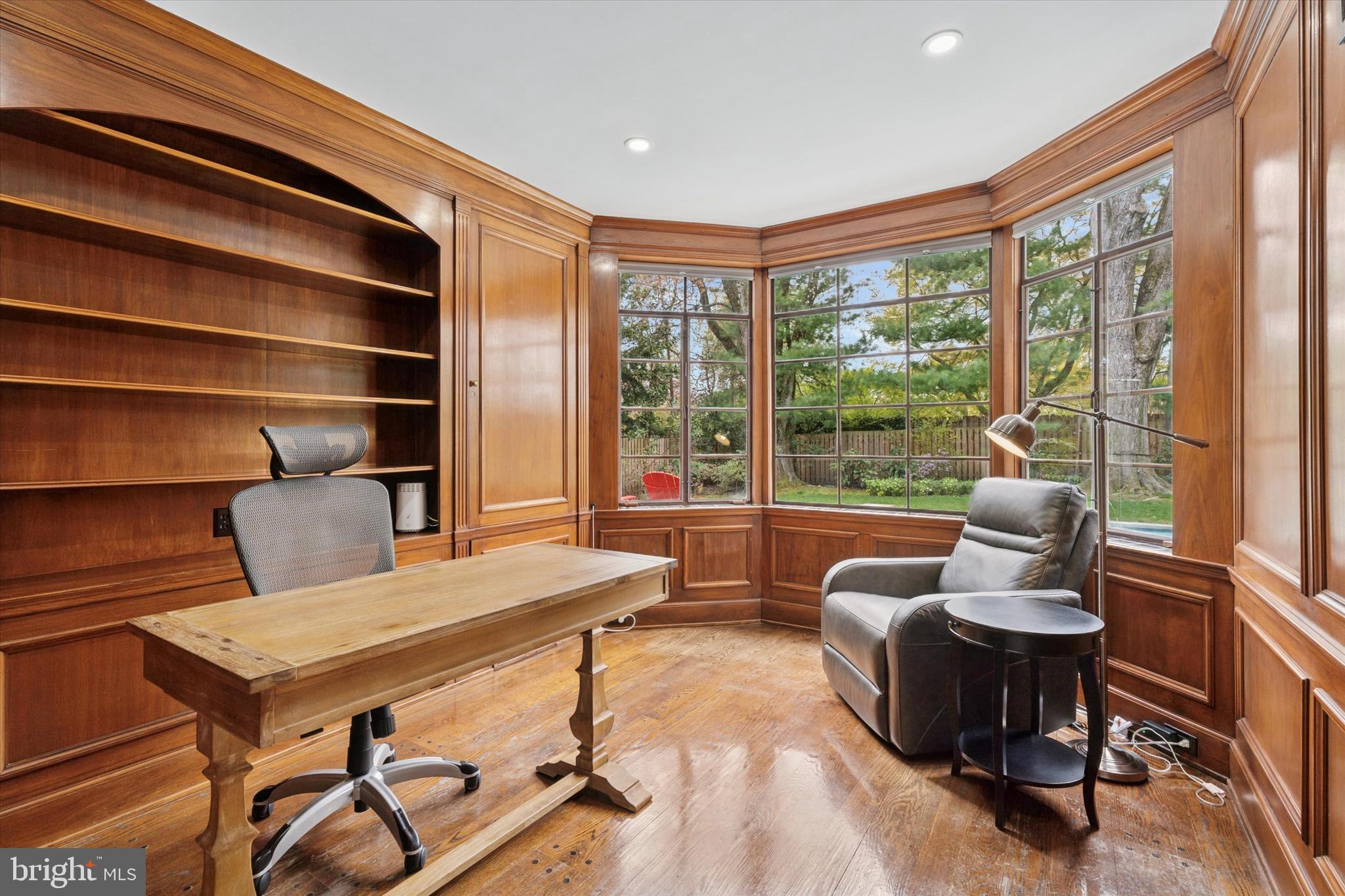 110 Raynham Road Merion Station, PA 19066 - Photo 25 of 59 a living room with furniture a rug potted plant and a large window