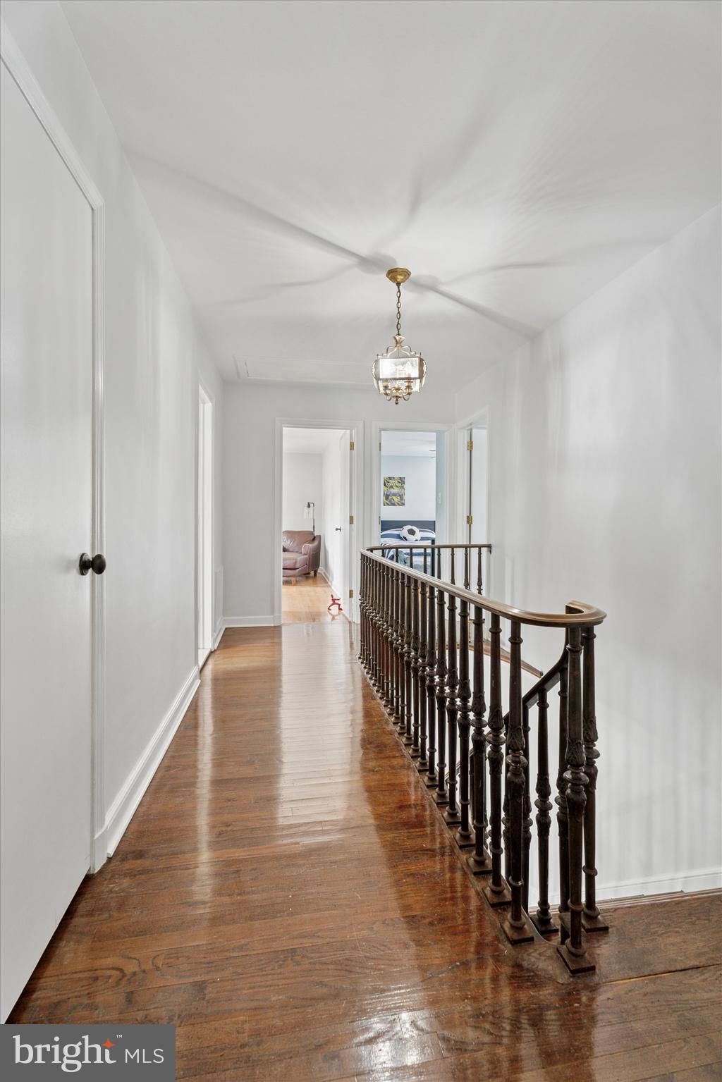 110 Raynham Road Merion Station, PA 19066 - Photo 32 of 59 a view of a hallway with wooden floor and staircase