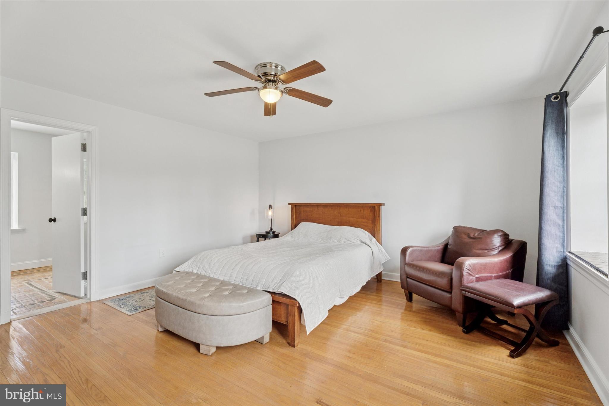 110 Raynham Road Merion Station, PA 19066 - Photo 33 of 59 a bedroom with a bed and chair