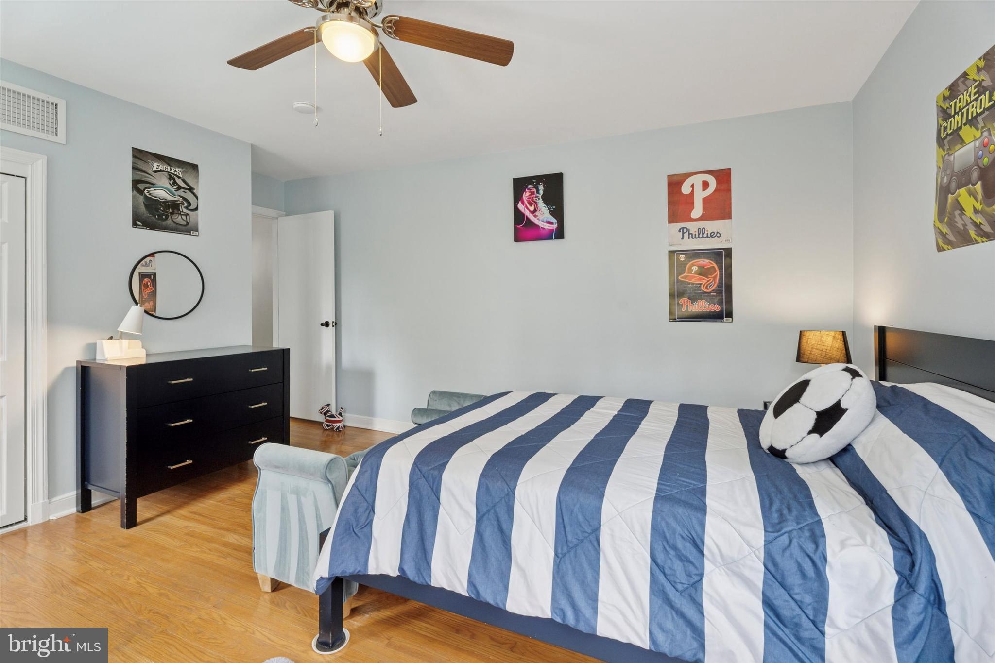 110 Raynham Road Merion Station, PA 19066 - Photo 42 of 59 a bedroom with a bed and a chandelier