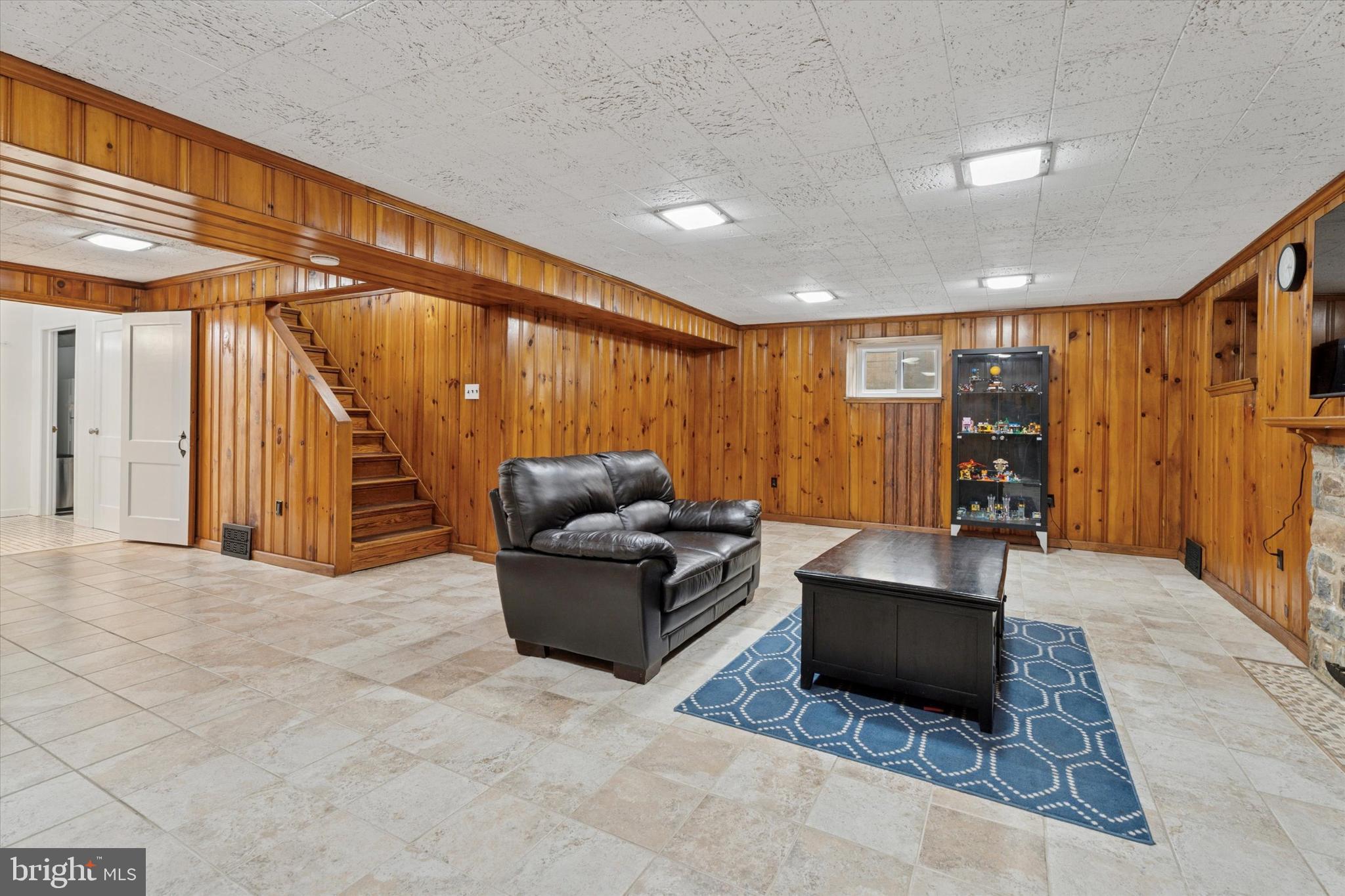 110 Raynham Road Merion Station, PA 19066 - Photo 49 of 59 a living room with furniture a ceiling fan and a rug
