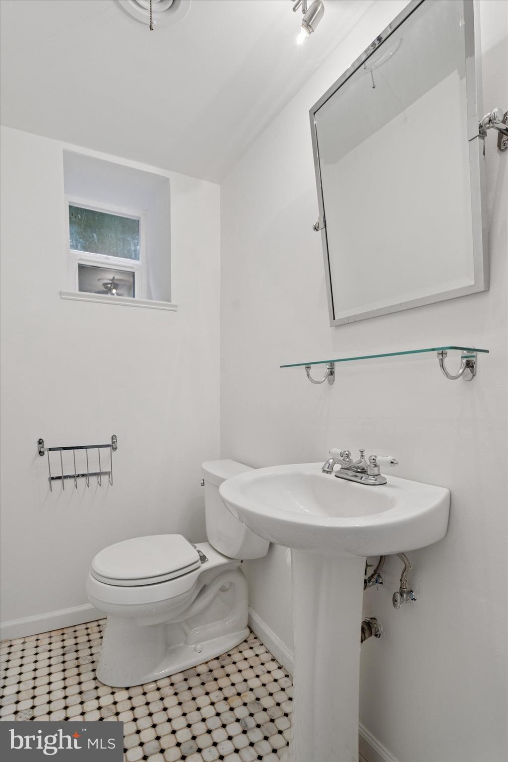 110 Raynham Road Merion Station, PA 19066 - Photo 55 of 59 a bathroom with a sink toilet and a mirror