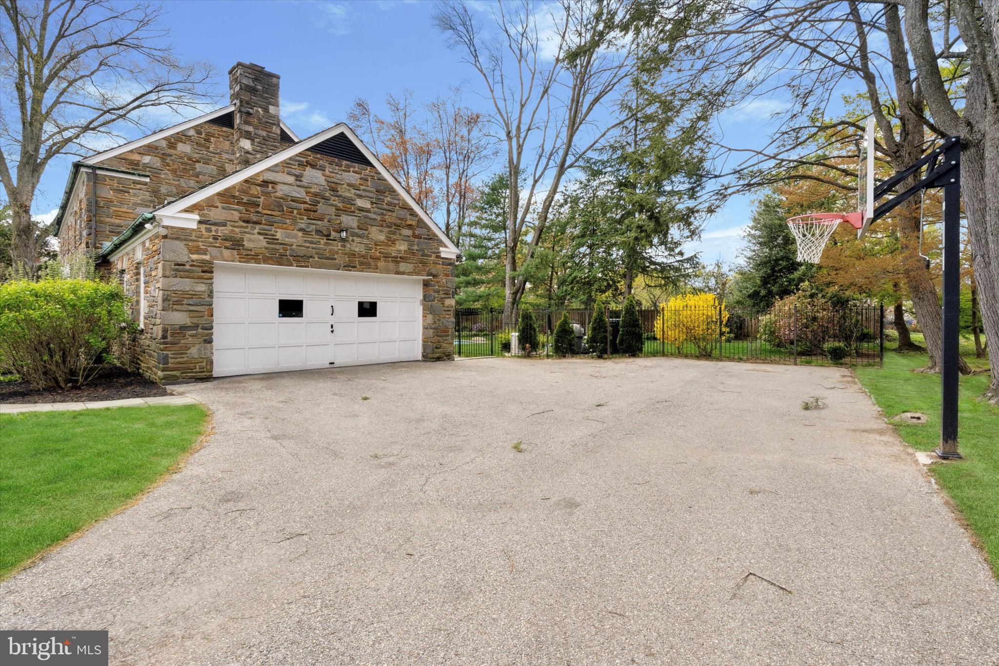 110 Raynham Road Merion Station, PA 19066 - Photo 6 of 59 a view of large house with a big yard and large trees