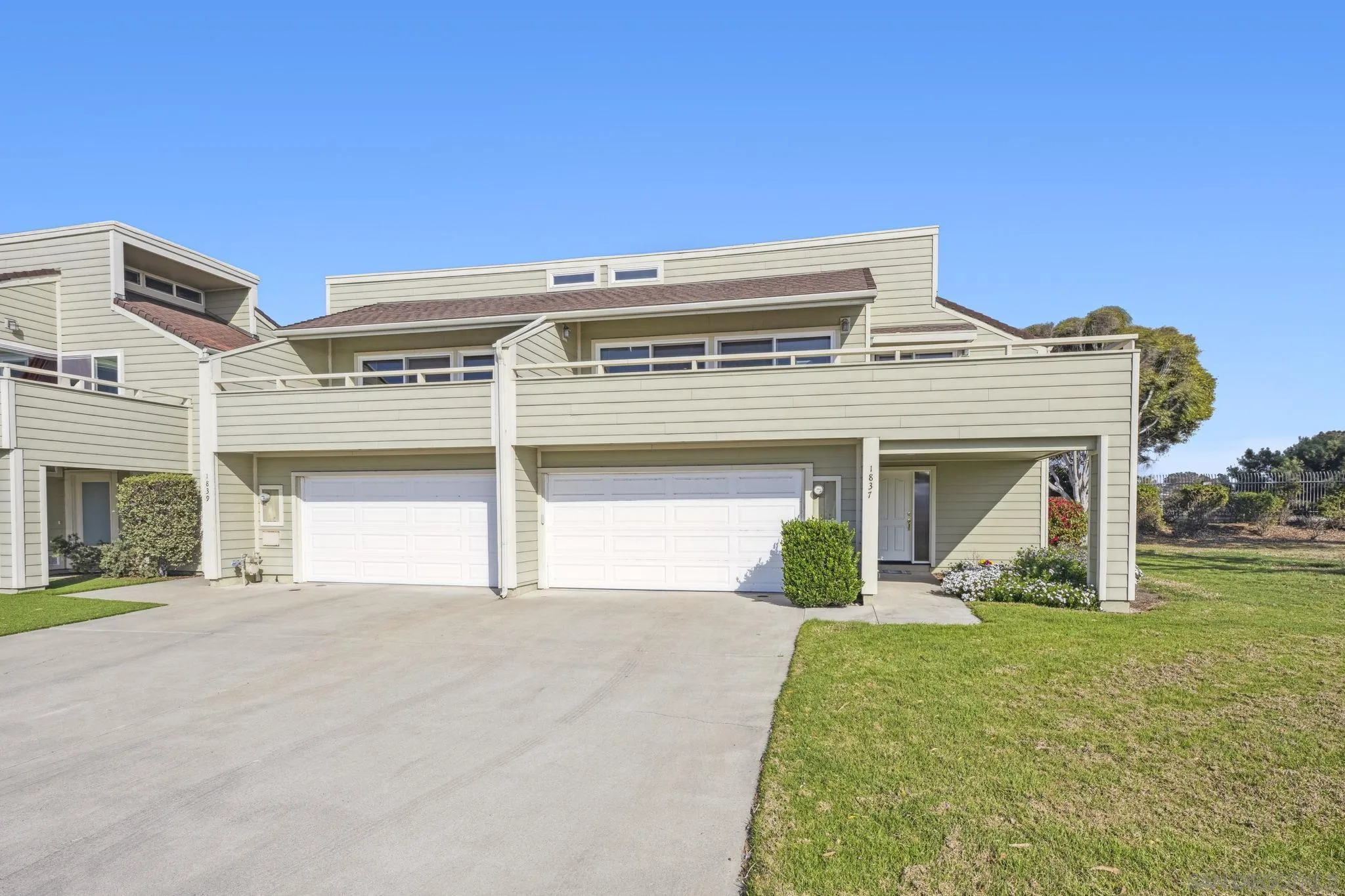 1837 Haymarket Road Encinitas, CA 92024 - Photo 54 of 54 a view of a white house with a big yard and large trees