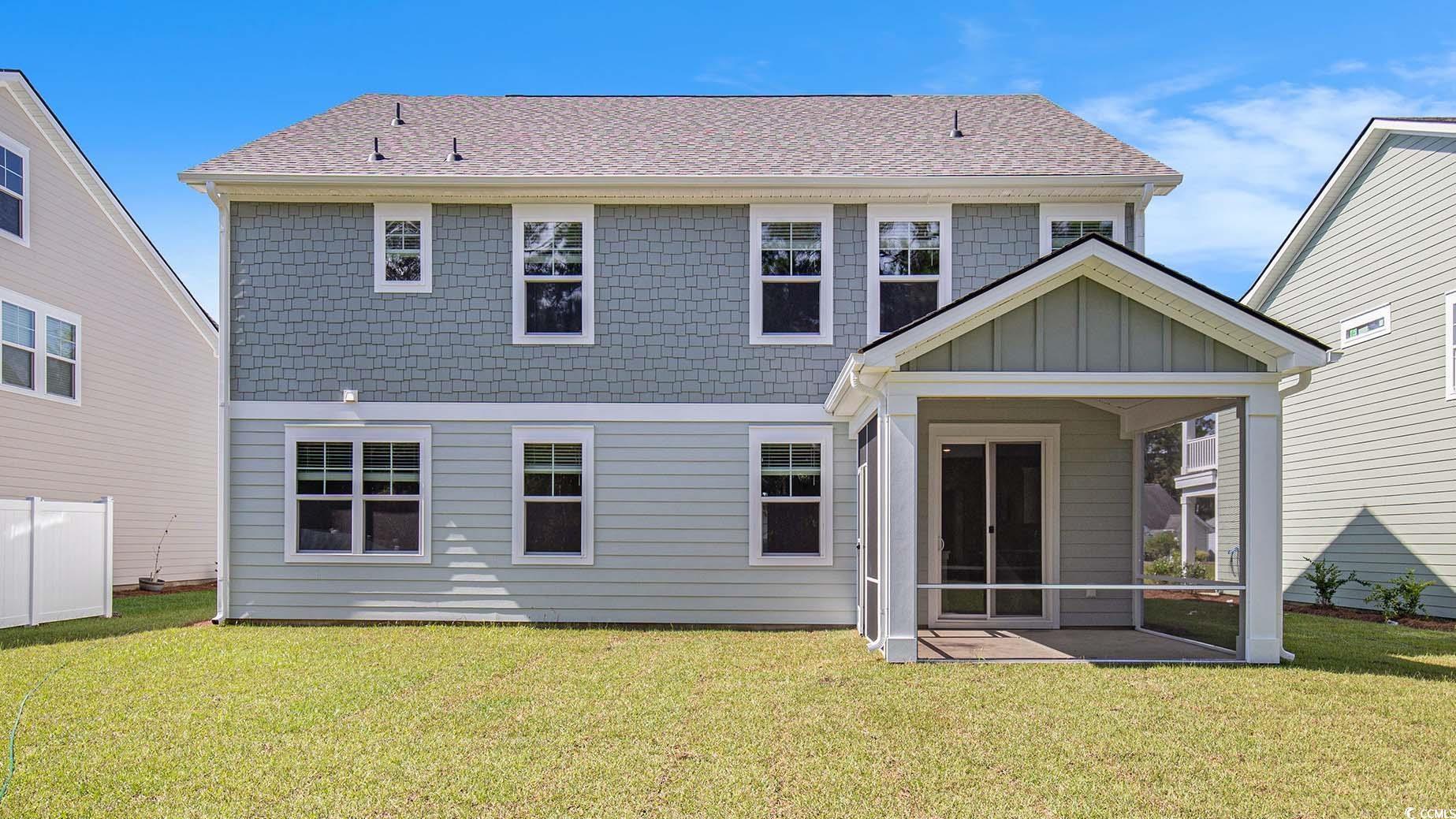 245 Konik Street Conway, SC 29526 - Photo 19 of 25 Rear view of property with a yard, a sunroom, a shingled roof, and board and batten siding