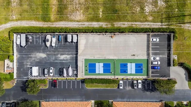 a view of a lake with houses in the back