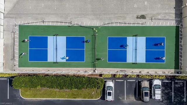 a view of a lake with houses in the back