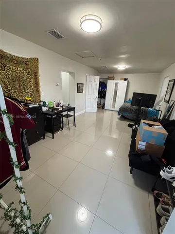 a living room with furniture gym equipment and a view of living room