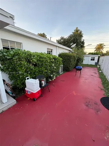 a swimming pool with outdoor seating and yard
