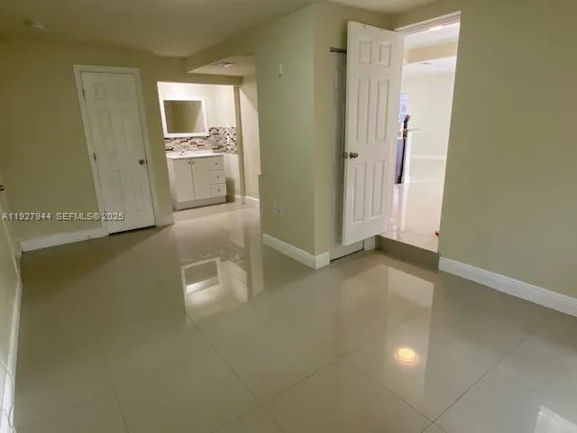 a view of a storage & utility room with a window
