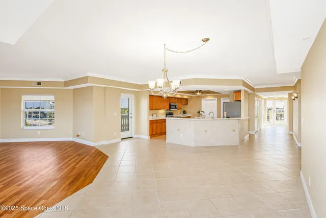 a large kitchen with stainless steel appliances kitchen island granite countertop a sink and cabinets