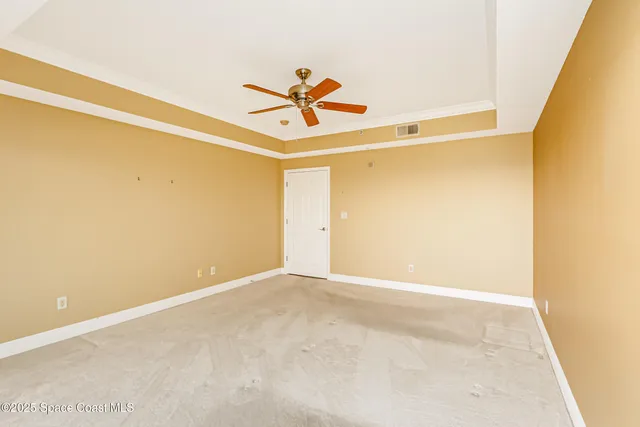 an aerial view of residential building and lake