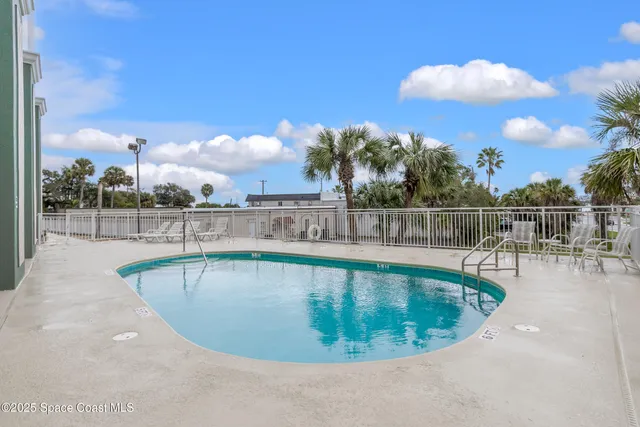 an aerial view of a house with outdoor space and lake view