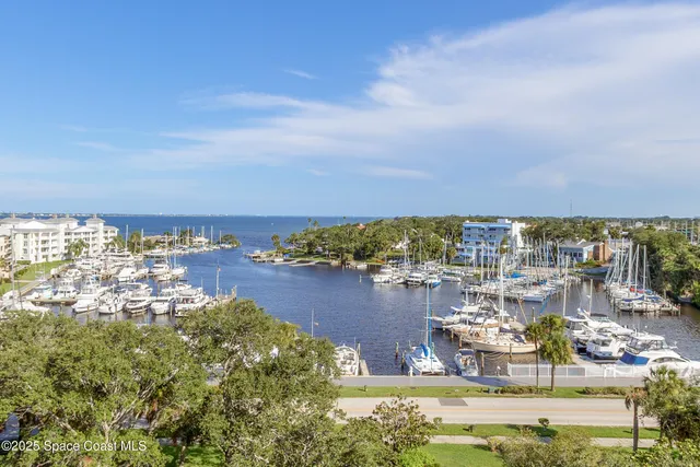 a terrace with outdoor seating and city view