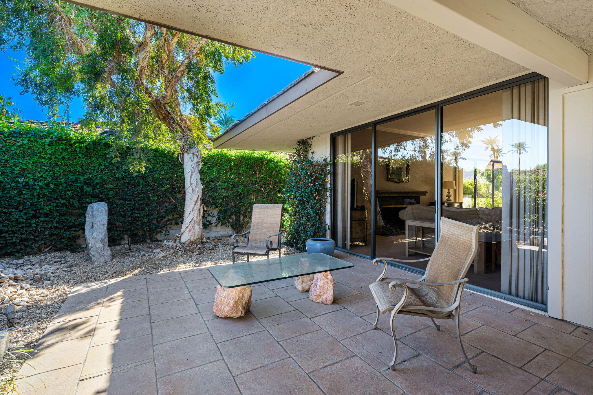 13 Duke Drive Rancho Mirage, CA 92270 - Photo 14 of 68 a view of a chairs and table in the patio