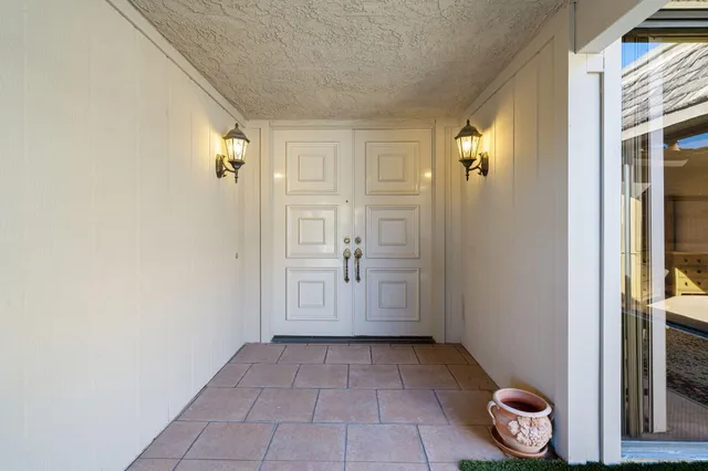 a kitchen with granite countertop a sink and a counter top space