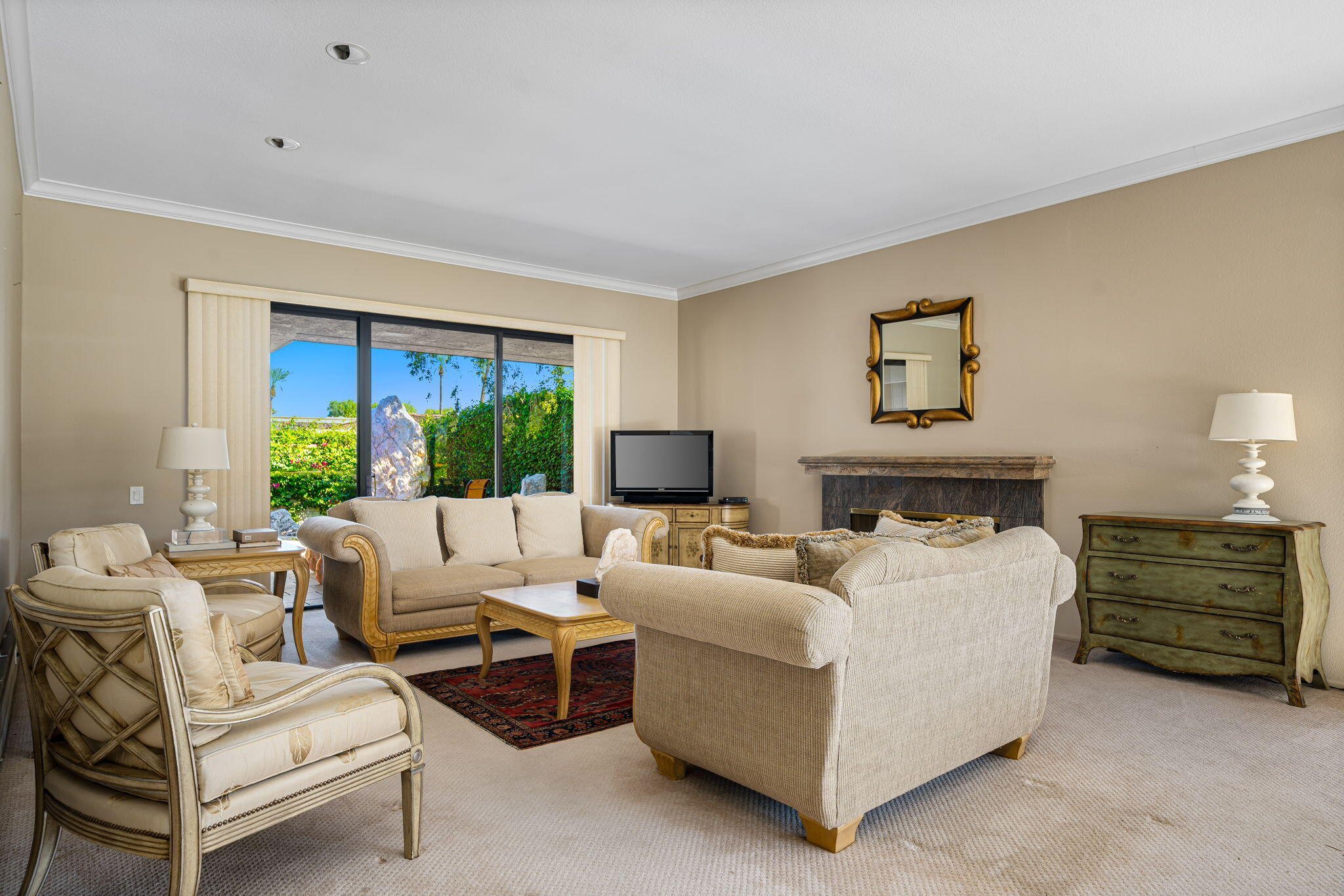 13 Duke Drive Rancho Mirage, CA 92270 - Photo 20 of 68 a living room with furniture and a large window