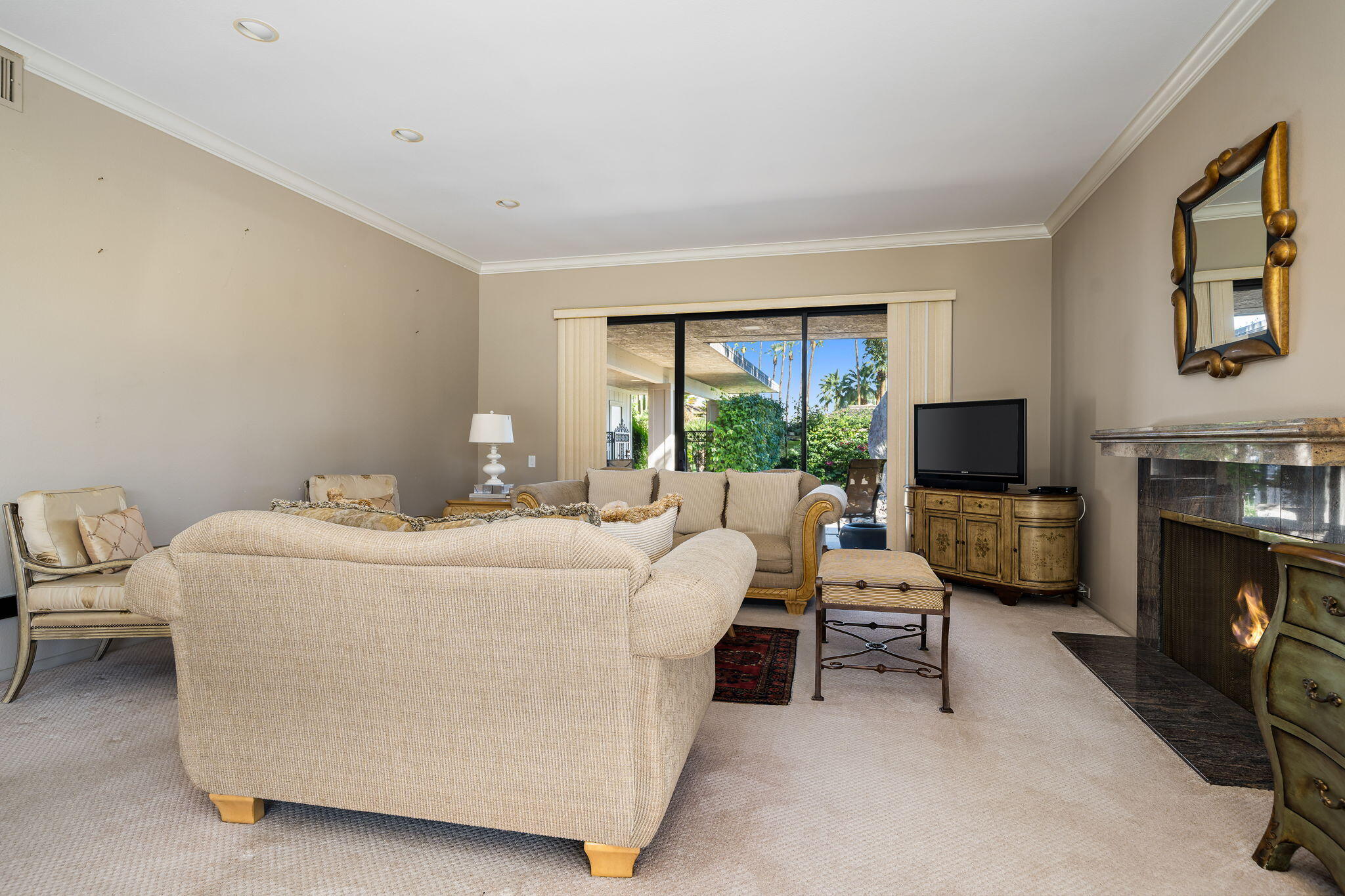 13 Duke Drive Rancho Mirage, CA 92270 - Photo 22 of 68 a living room with furniture and a flat screen tv