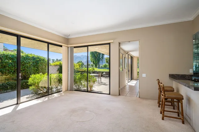 a patio with table and chairs