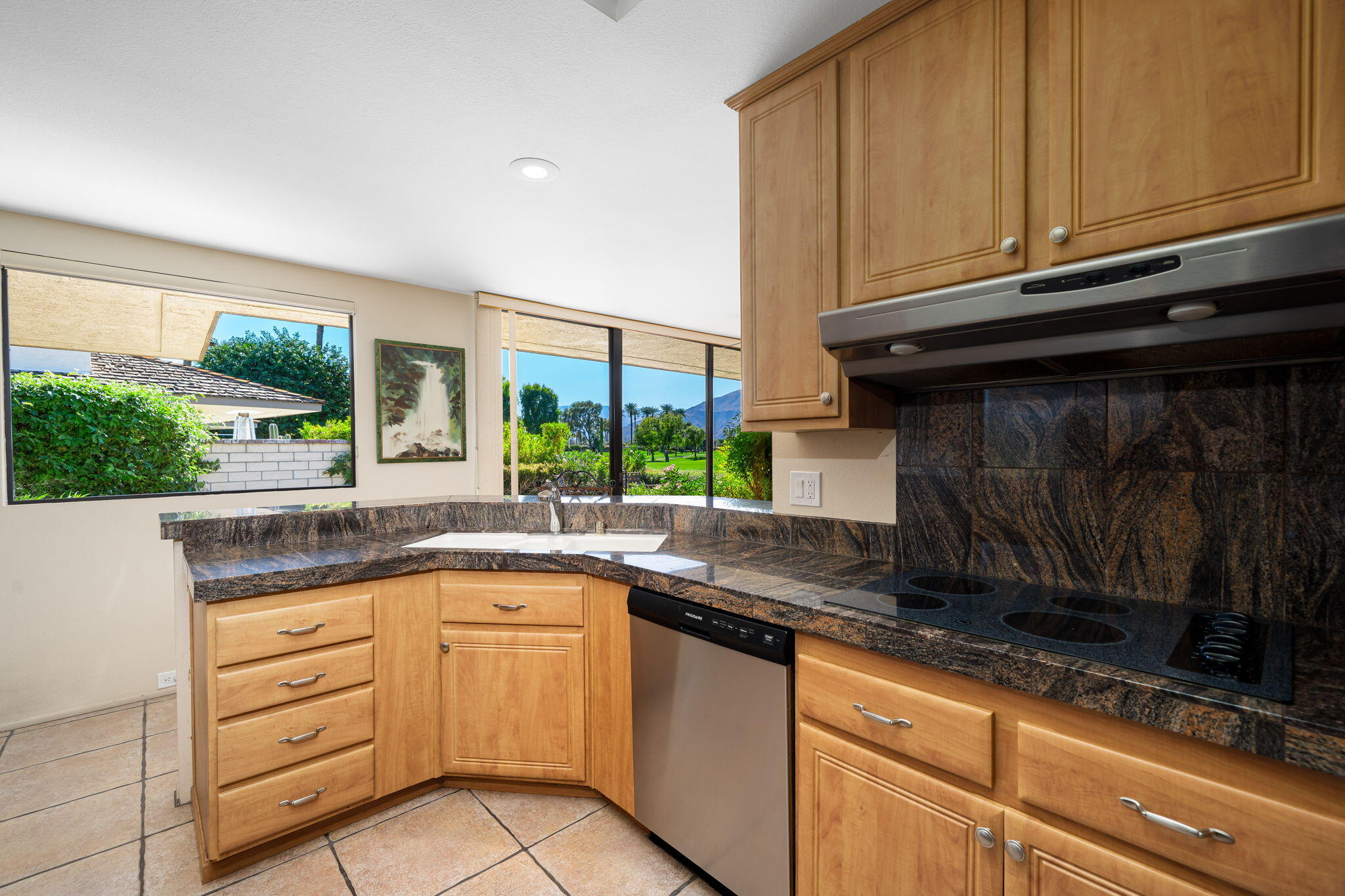 13 Duke Drive Rancho Mirage, CA 92270 - Photo 33 of 68 a kitchen with granite countertop a sink and a stove