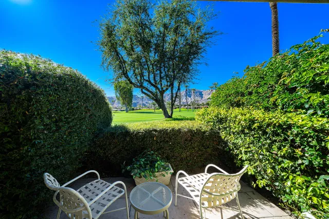 a bedroom with a bed and a mirror