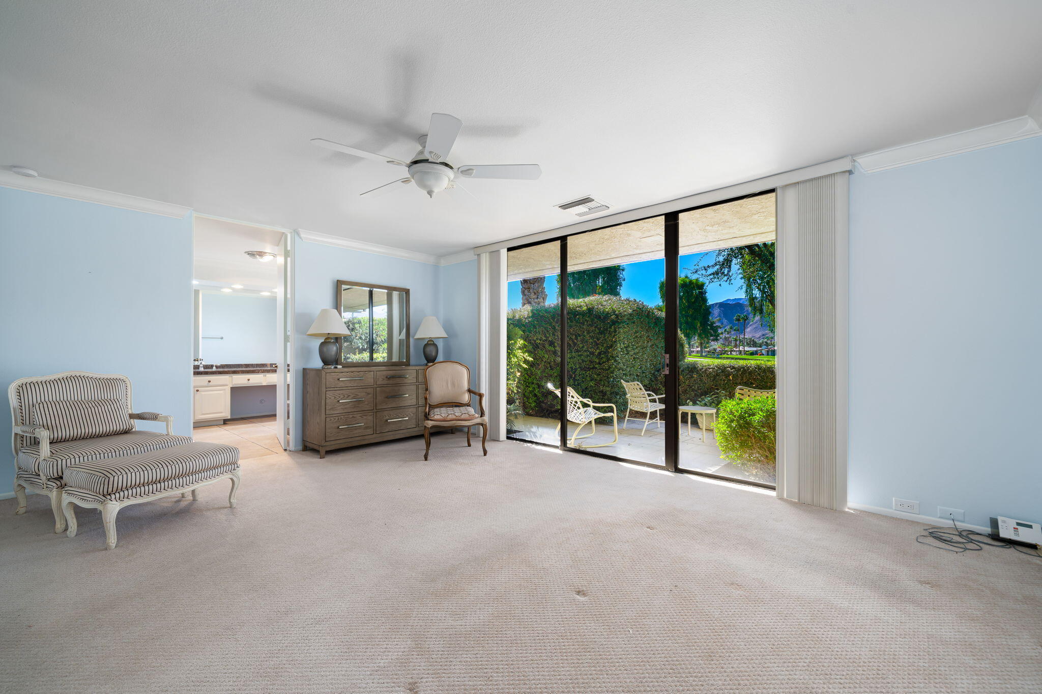 13 Duke Drive Rancho Mirage, CA 92270 - Photo 39 of 68 a living room with furniture and a flat screen tv