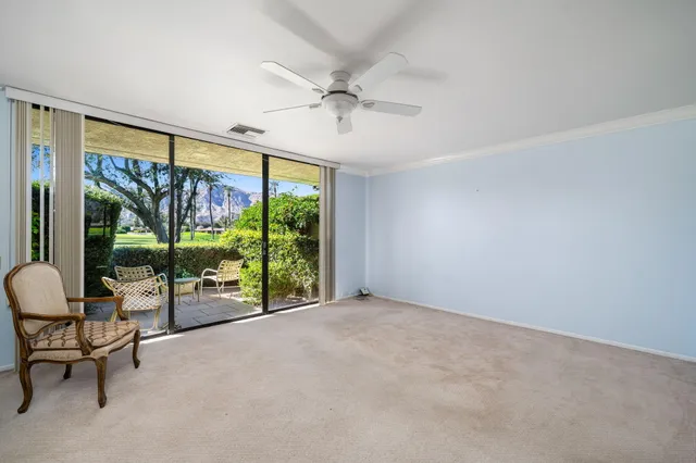 a view of a swimming pool with an outdoor seating