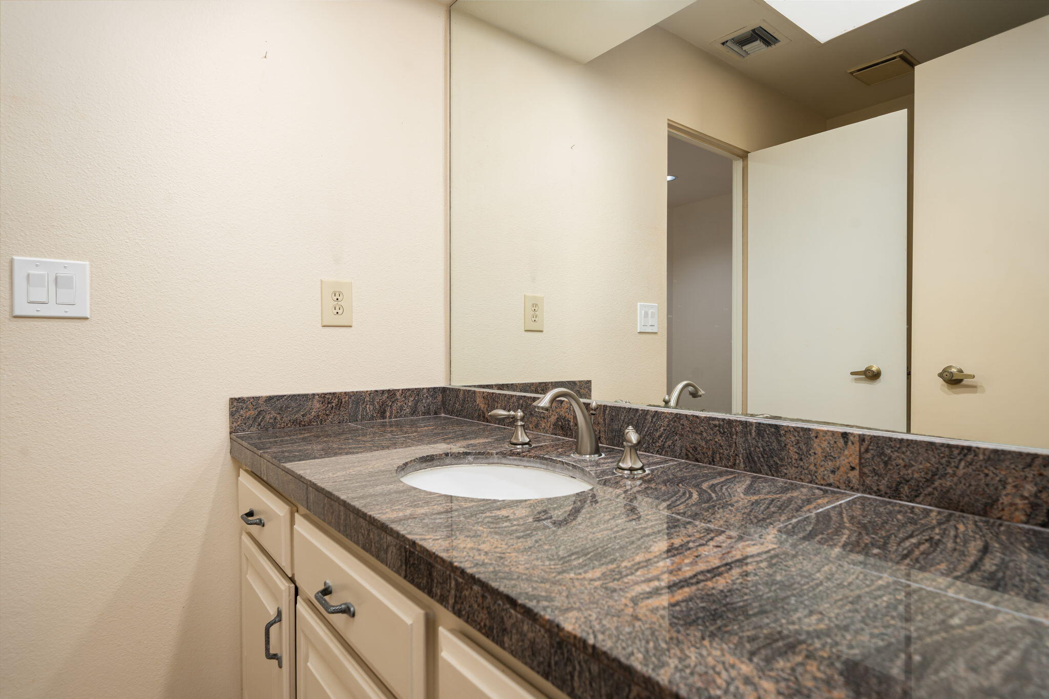 13 Duke Drive Rancho Mirage, CA 92270 - Photo 46 of 68 a bathroom with a sink and a mirror
