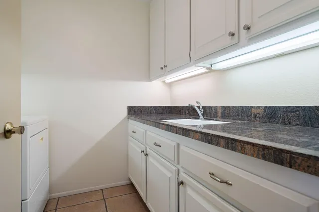 a view of backyard with swimming pool and outdoor seating